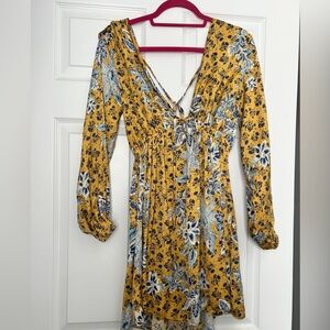 Free People Mini Dress in yellow with blue detailing and long sleeves. Open back